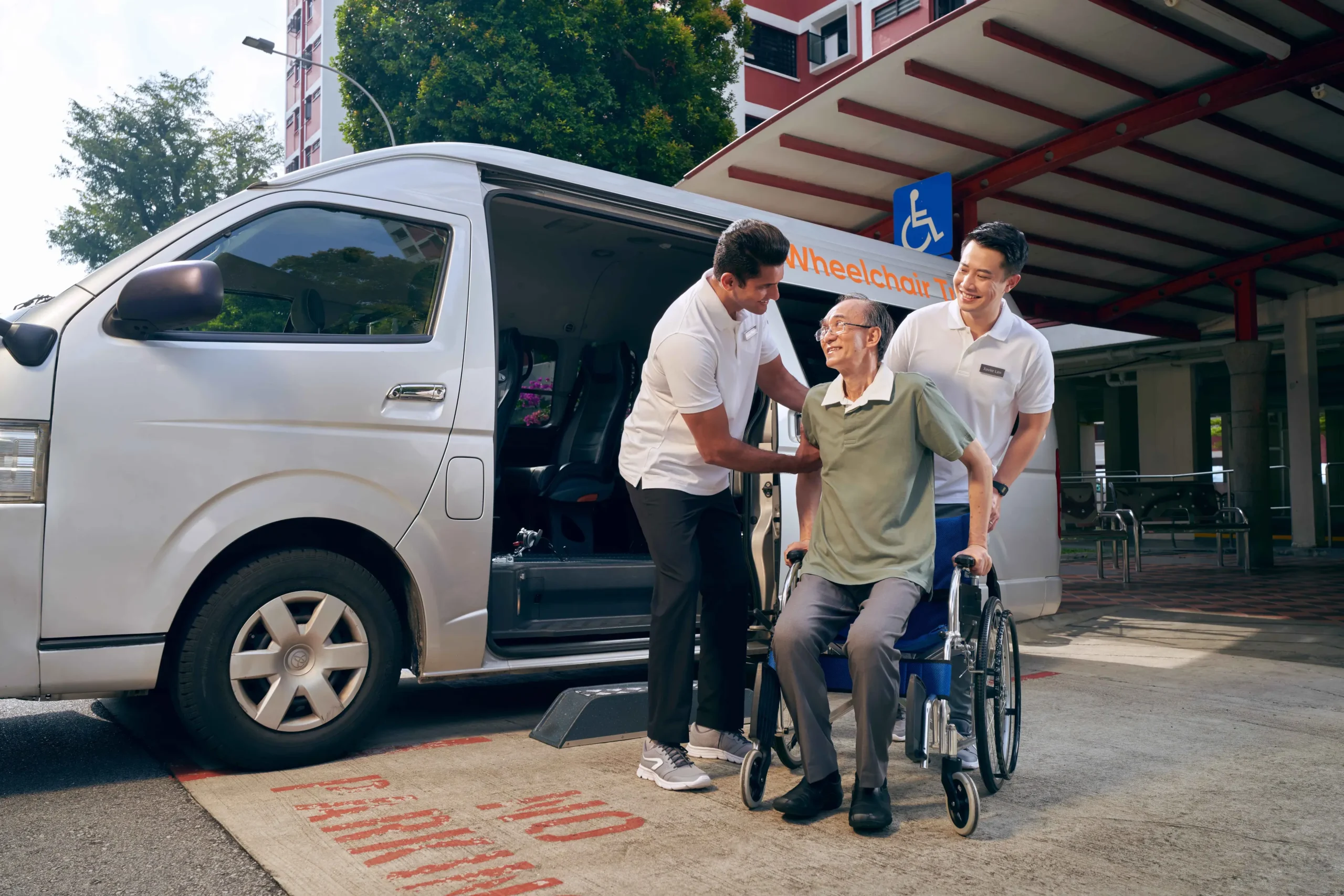 Dedicated Corporate Wheelchair Transport driver assisting a client in Avon, CT, showcasing the company's commitment to safety and comfort